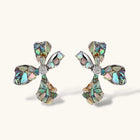 Pair of oversized four-petal flower stud earrings with iridescent teal and blush shell mosaic on silver-tone petals.