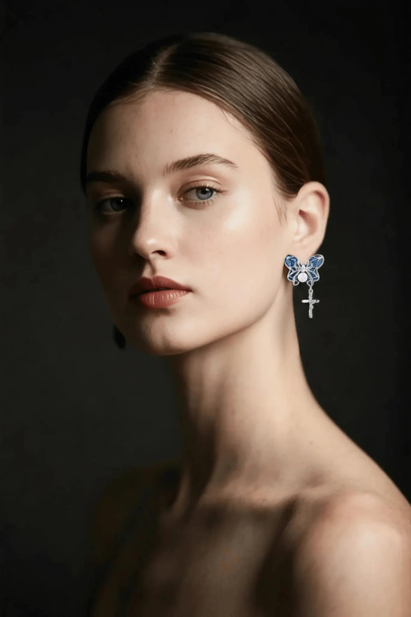 Woman wearing butterfly cross earrings, Christian jewelry gift